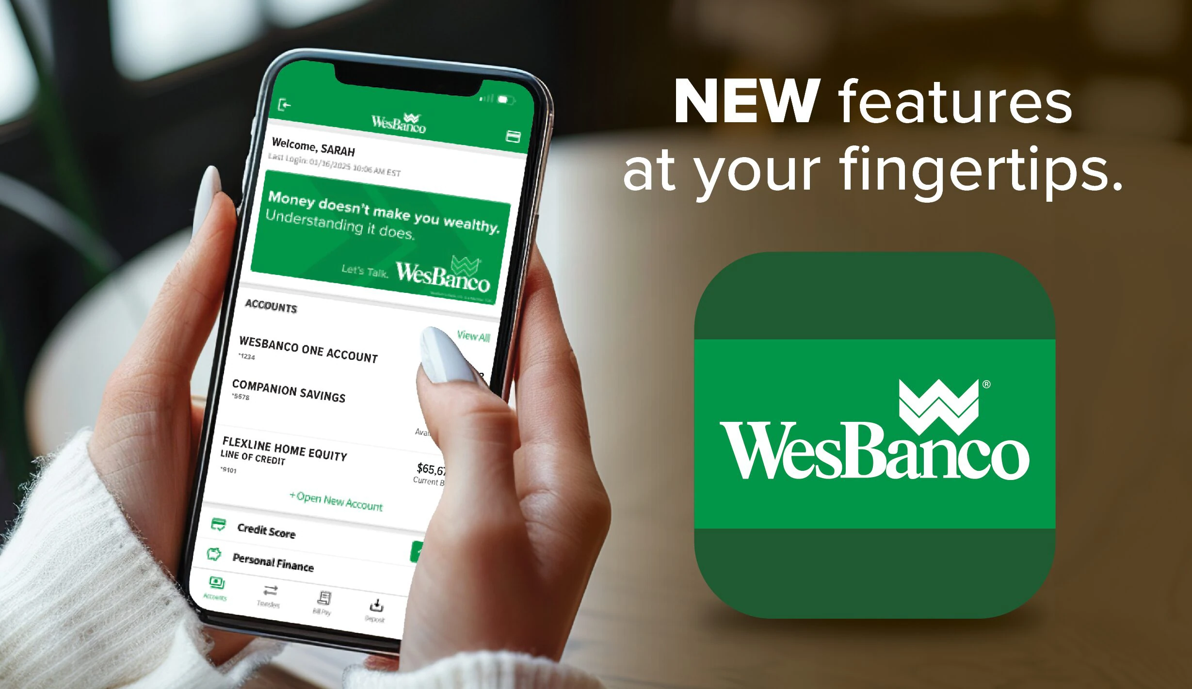 Person holding a mobile phone looking at the wesbanco mobile banking app text reads new features at your fingertips